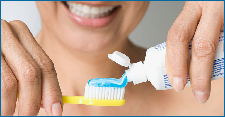 Brushing of teeth twice a day with a fluoride containing toothpaste