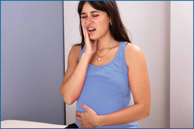 Pregnant woman suffering from toothache