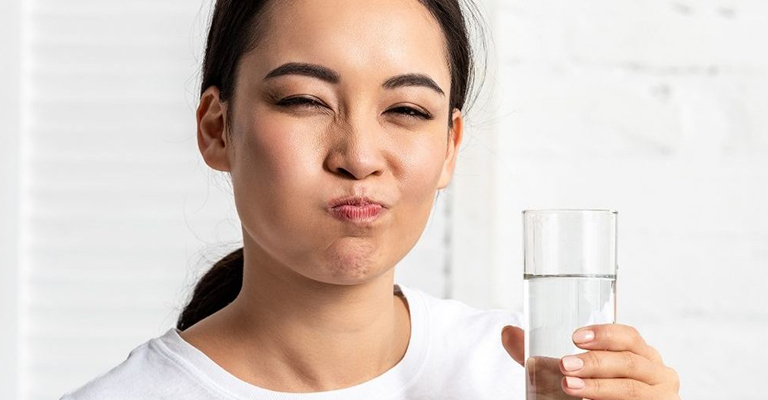 mouth rinsing lady