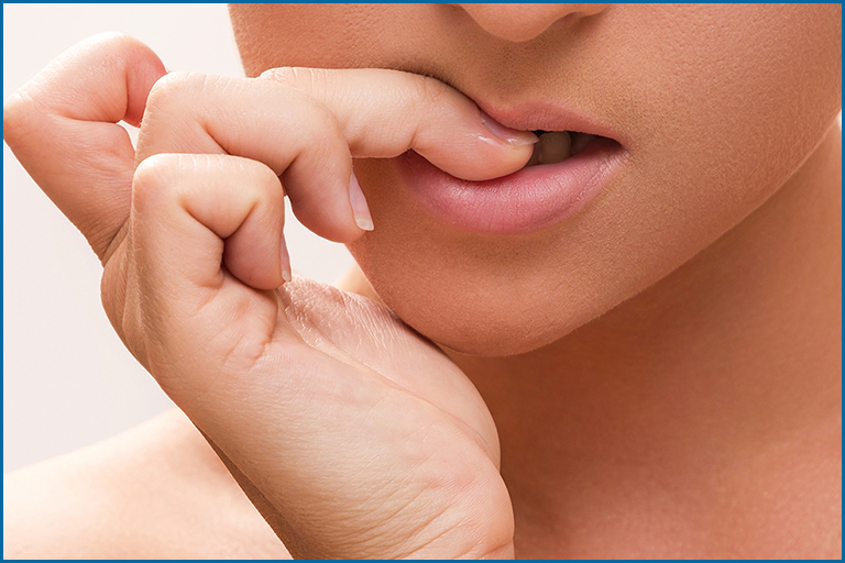 girl biting nails